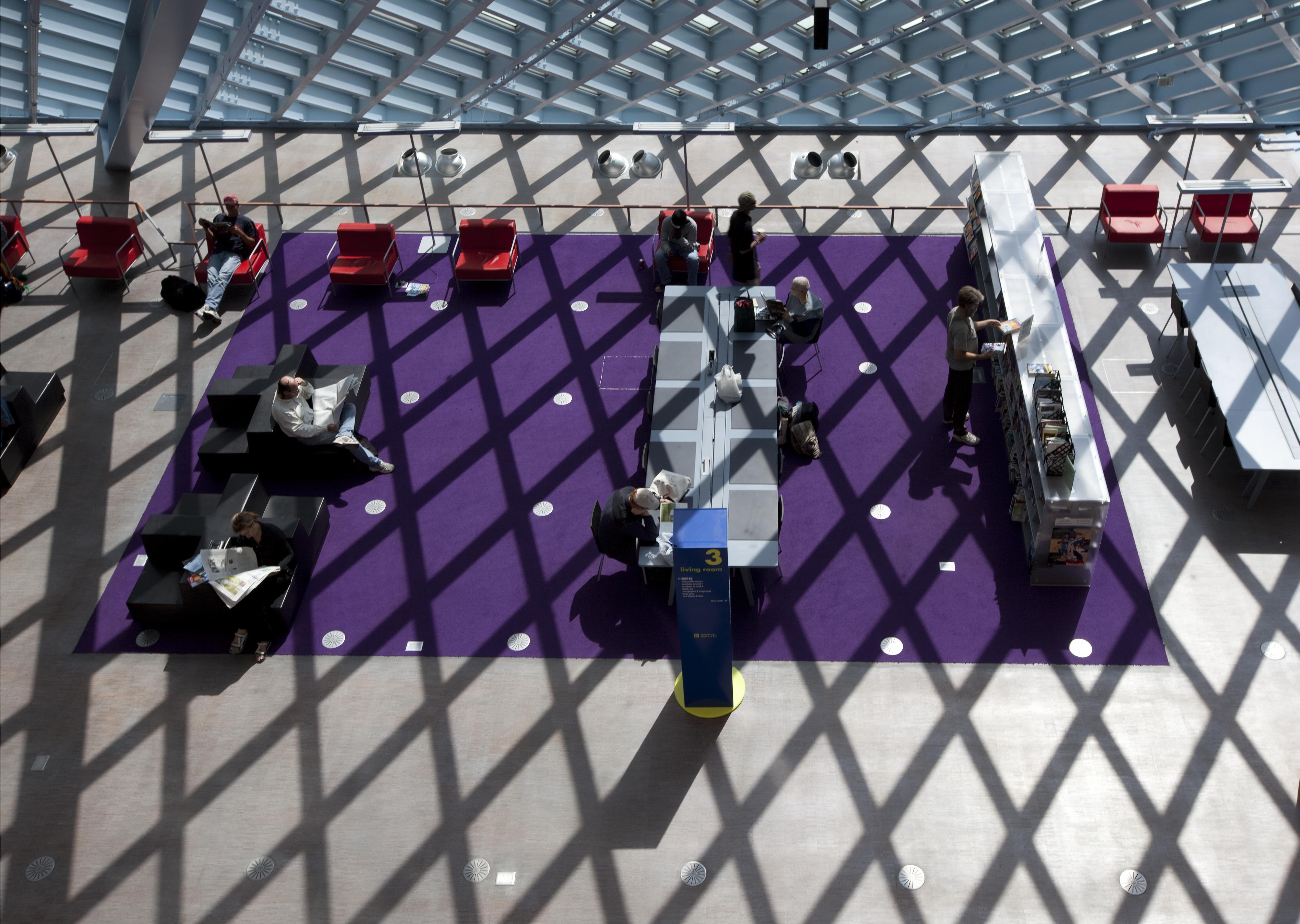 Readers moving through the open floors of the Seattle Central Library